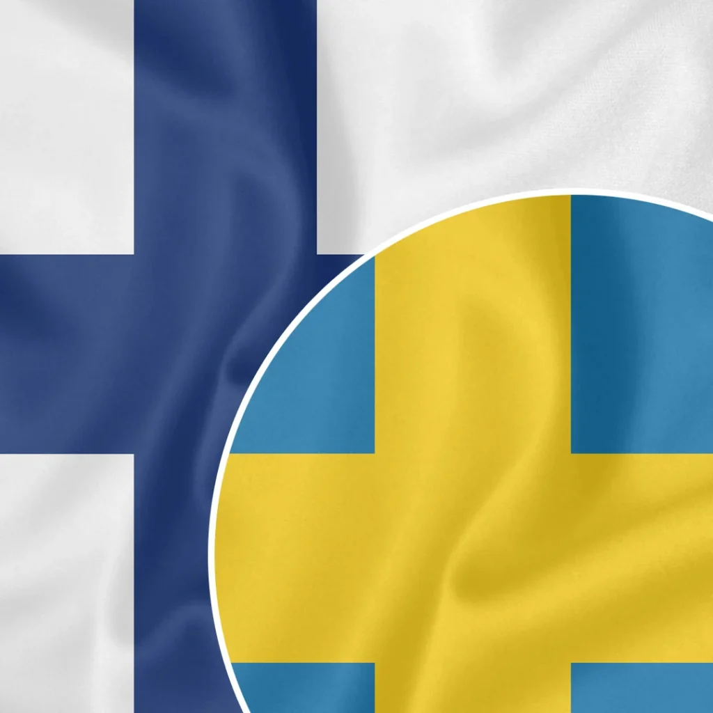 Image of two overlapping flags. The background flag is Finland's, featuring a blue Nordic cross on a white field. The foreground flag is Sweden's, showcasing a yellow Nordic cross on a blue field, contained within a circular shape.